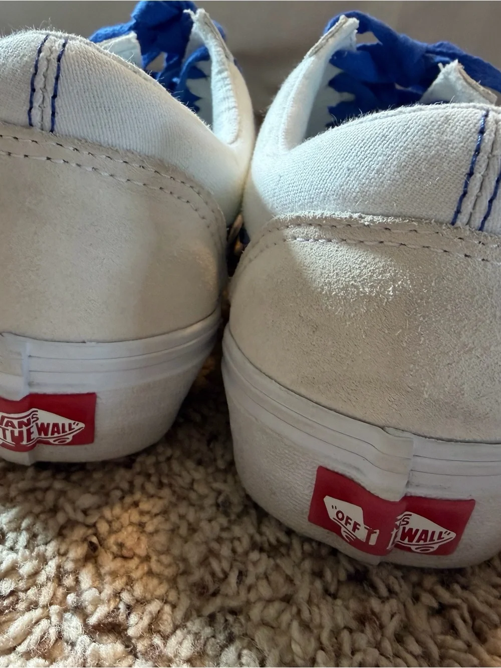 Vans white sneakers with blue stripe and laces